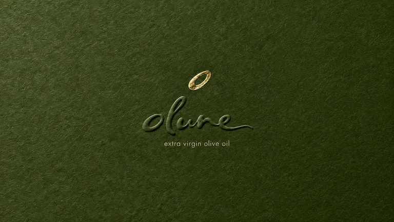 Olune flowing script and olive emblem, gold foil on textured forest-green material